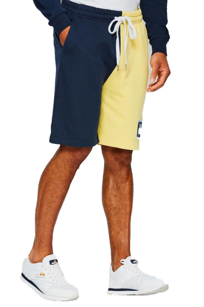 BERMUDA ELLESSE AMARILLA OVERSIZED LOGO BORDADO - AREA ZERO